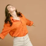 something in the orange shirt